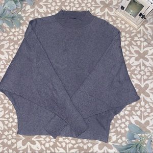 Grey long sleeve top.